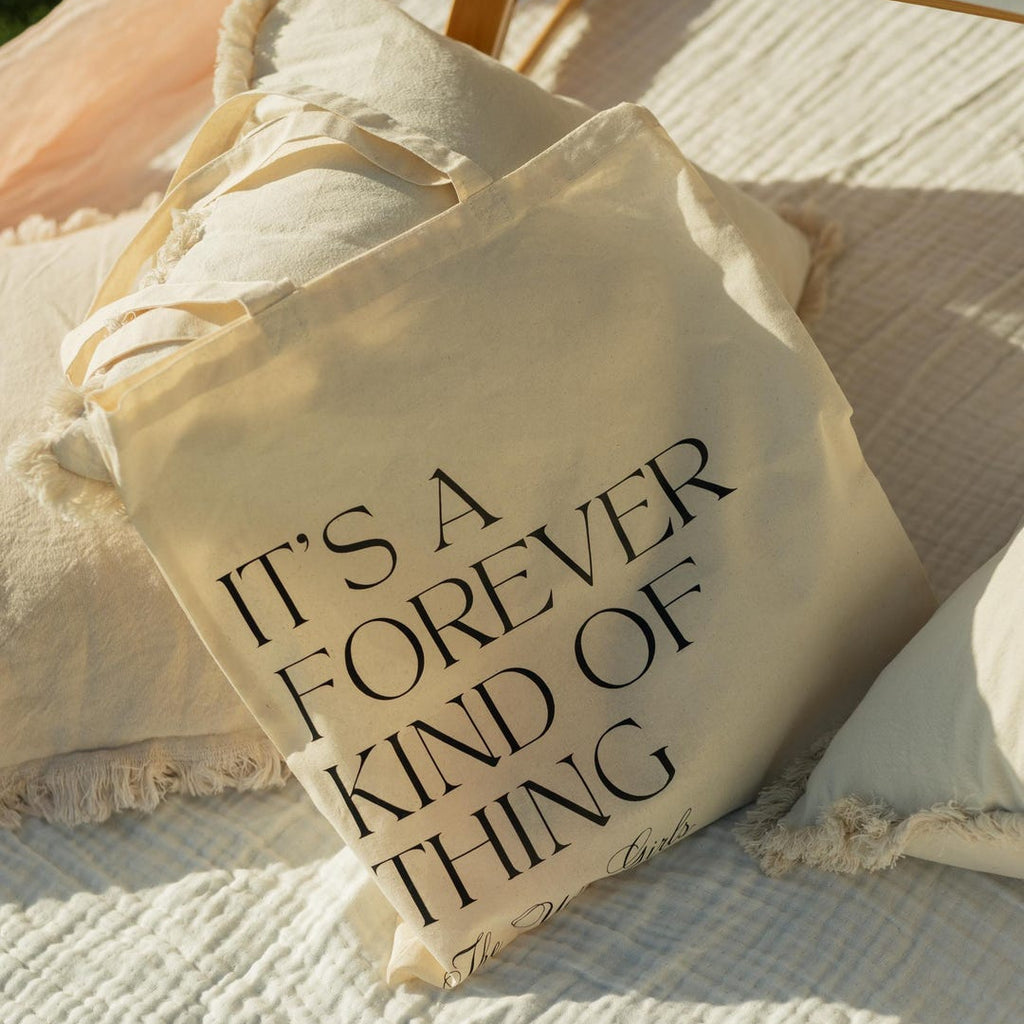 Personalized wedding favor tote bag in natural cotton canvas with custom text and ribbon