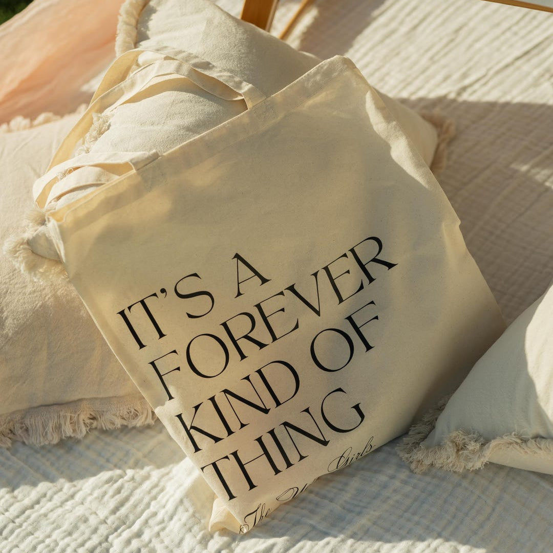 Personalized wedding favor tote bag in natural cotton canvas with custom text and ribbon